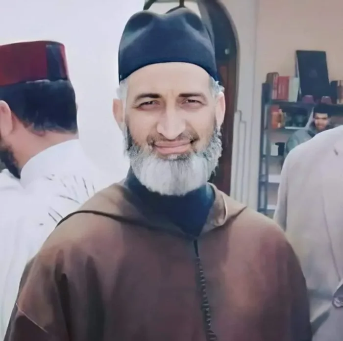 Islamic Scholar Sheikh Dr. Farid El Ansari wearing traditional Moroccan attire and cap